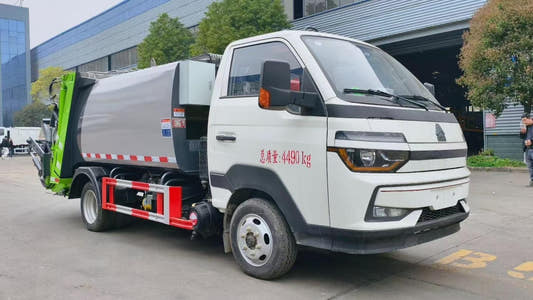 Used Sinotruk HOWO 4M³ Compressed Garbage Truck for Sale rear side view