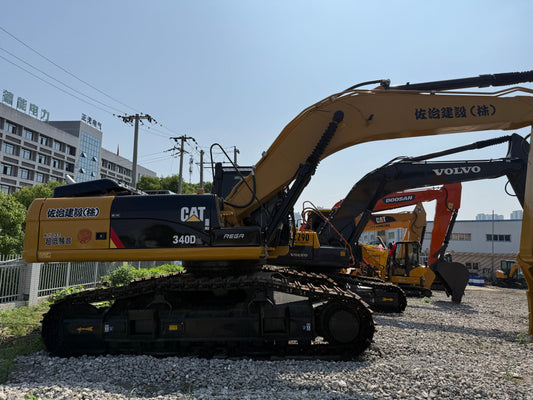 2022 used CAT 340D2L excavator left side view in the machinery yard
