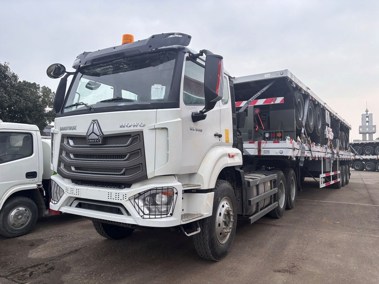New Howo 540HP Flatbed Truck for Sale rear side view