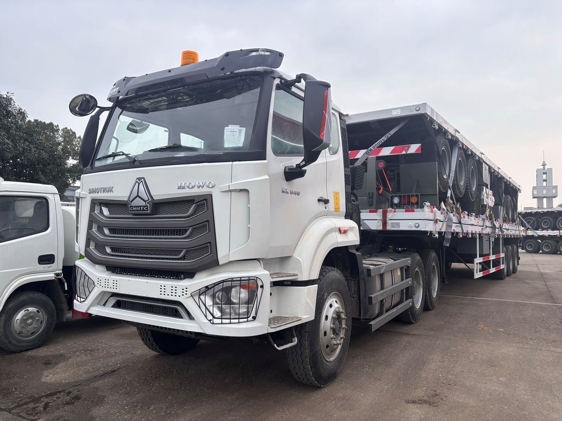 New Howo 540HP Flatbed Truck for Sale rear side view