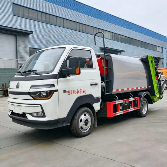 Used Sinotruk HOWO 4M³ Compressed Garbage Truck for Sale side view
